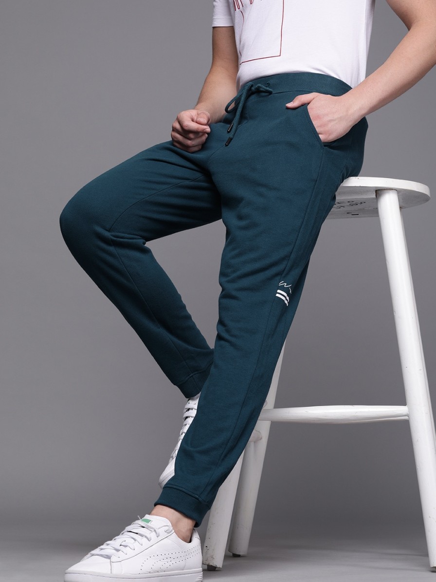 Men WROGN Track Pants & Shorts | Buy Wrogn Men Teal Blue Slim Fit Solid Cropped Joggers With Printed Details - Track Pants For Men 11361924 | Myntra