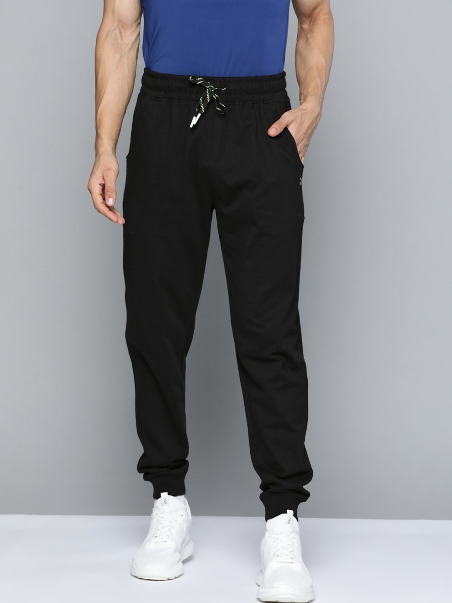 Men HRX by Hrithik Roshan Track Pants & Shorts | Buy Hrx By Hrithik Roshan Lifestyle Men Jet Black Bio Wash Track Pants - Apparel For Men